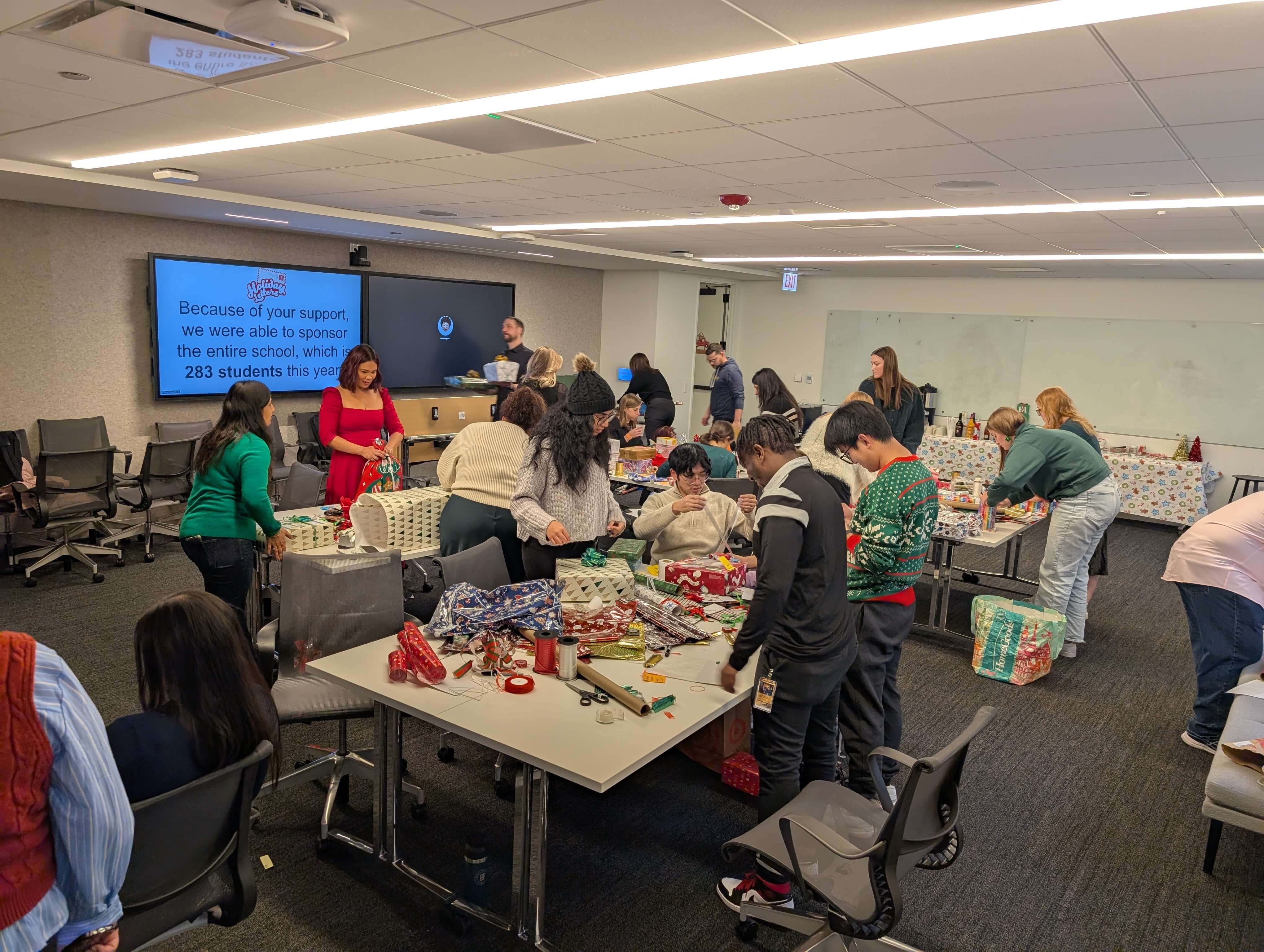 Relativians helping wrap gifts for our Holiday Letters campaign